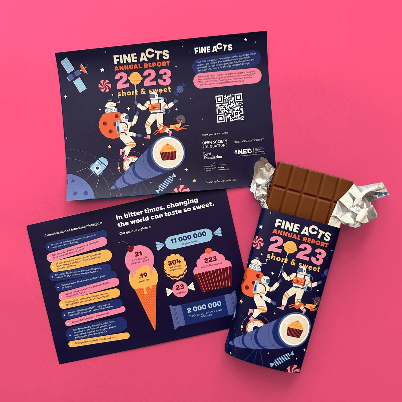 Unfolded Fine Acts wrapper and chocolate bar on a pink background